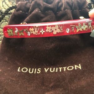 Red Louis Vuitton brooch
